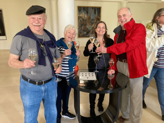 Travelers Alex and Judy enjoying a Champagne tasting with friends at the Taittinger Champagne House in Reims