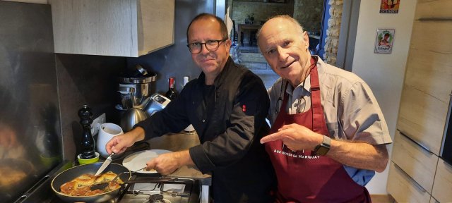 B&B host Eric cooking with a traveler