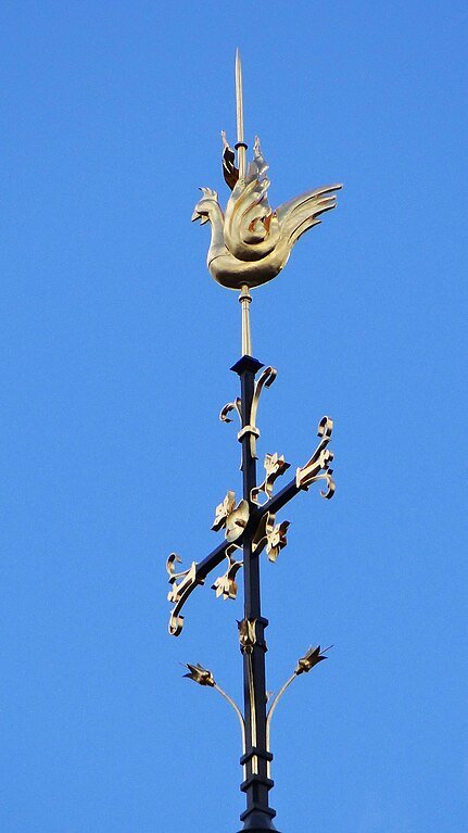 The gilded rooster at the top of the spire The gilded rooster at the top of the spire