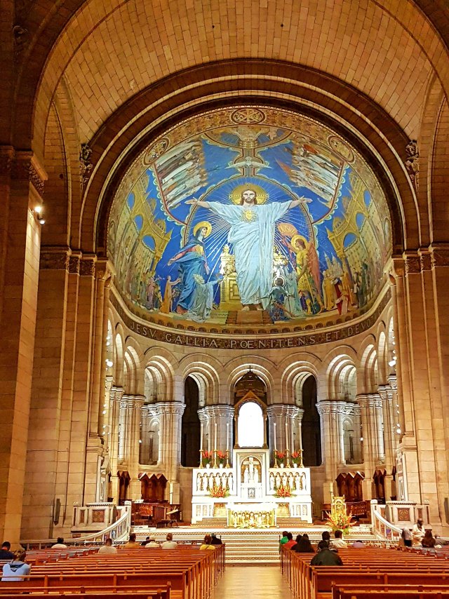 Inside the Sacré Coeur, showing the Christ in Glory mosaic inside the domed ceiling