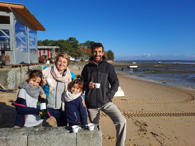 A family on the beach in Arcachon Bay